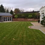 large stone summer house with patio doors